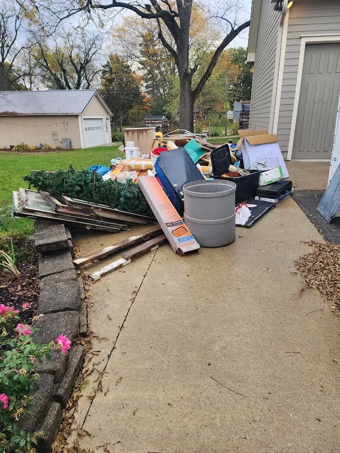 Dumpster being loaded with debris for 3 Yard Dumpster Rental in Frontenac